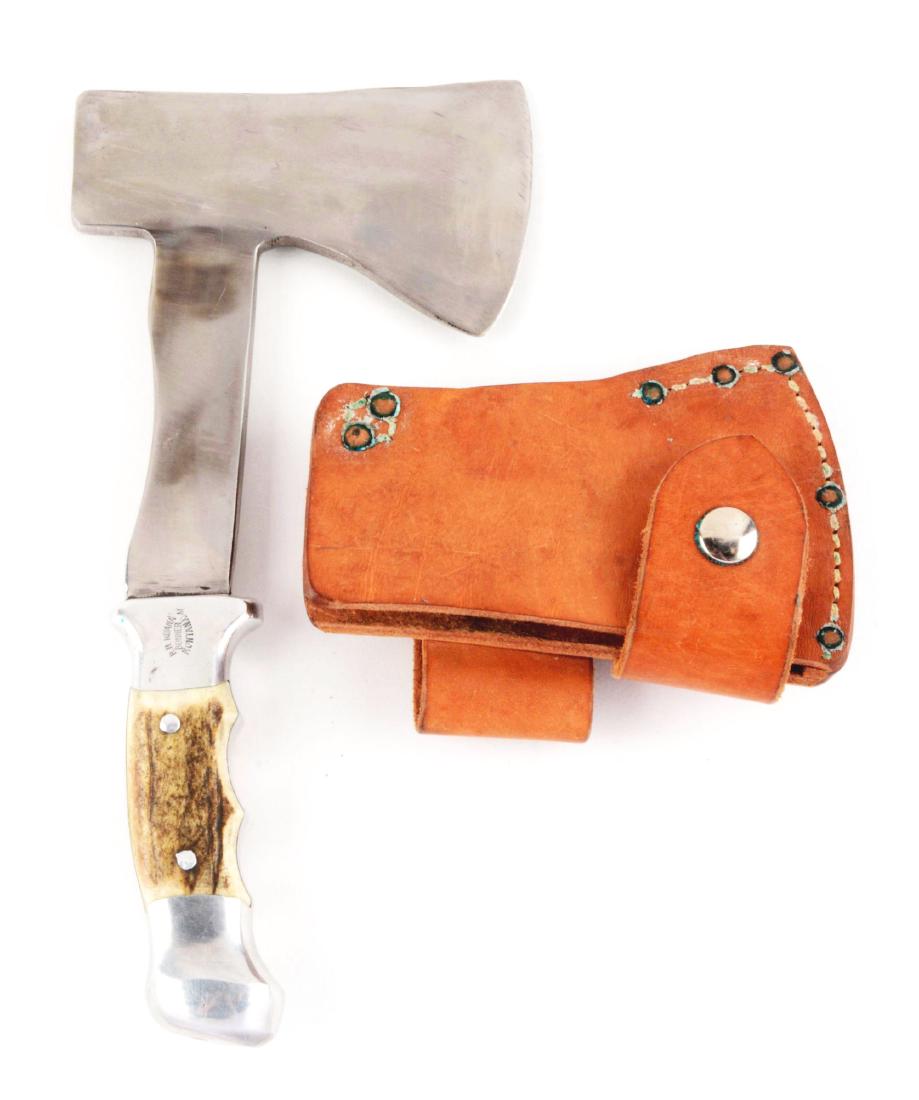 R.H. Ruana Stag Handled Hatchet 22A "M" Mark.: Long hatchet blade of 5-1/4" long x 3" wide. Integral aluminum finger notched handle with genuine stag inserts. Correct leather sheath. Blade Length: 5 - 1/4"Overall Length: 10 - 1/4"Paperwork: No Con