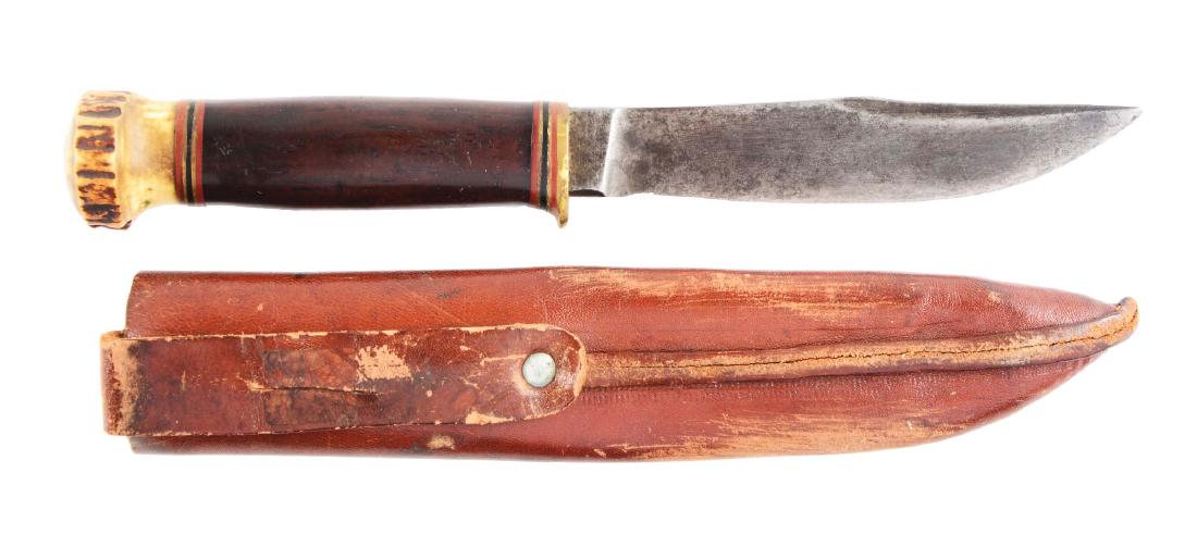 Marbles "Expert" Fixed Blade Knife.: Marbles - Gladstone Mich. U.S.A. - "Expert" 5" fixed blade; overall 9". Handled in cocobolo with brass half guard and stag crown. Correct leather tube sheath. Circa pre-1942.Blade Length: 5"Overall Le