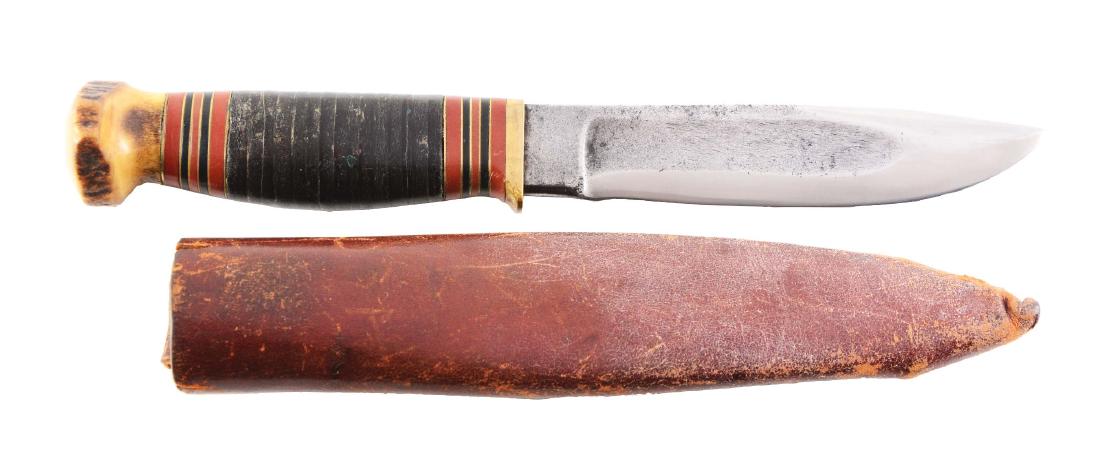 M.S.A. Co. Gladstone "Ideal" Fixed Blade Knife.: M.S.A. Co. - Gladstone Mich. U.S.A. - "Ideal" 4 - 5/8" blade; overall 8 - 1/2". Handled in stacked leather with brass finger guard and stag crown. Correct leather tube sheath. Circa pre-World War I.Bl