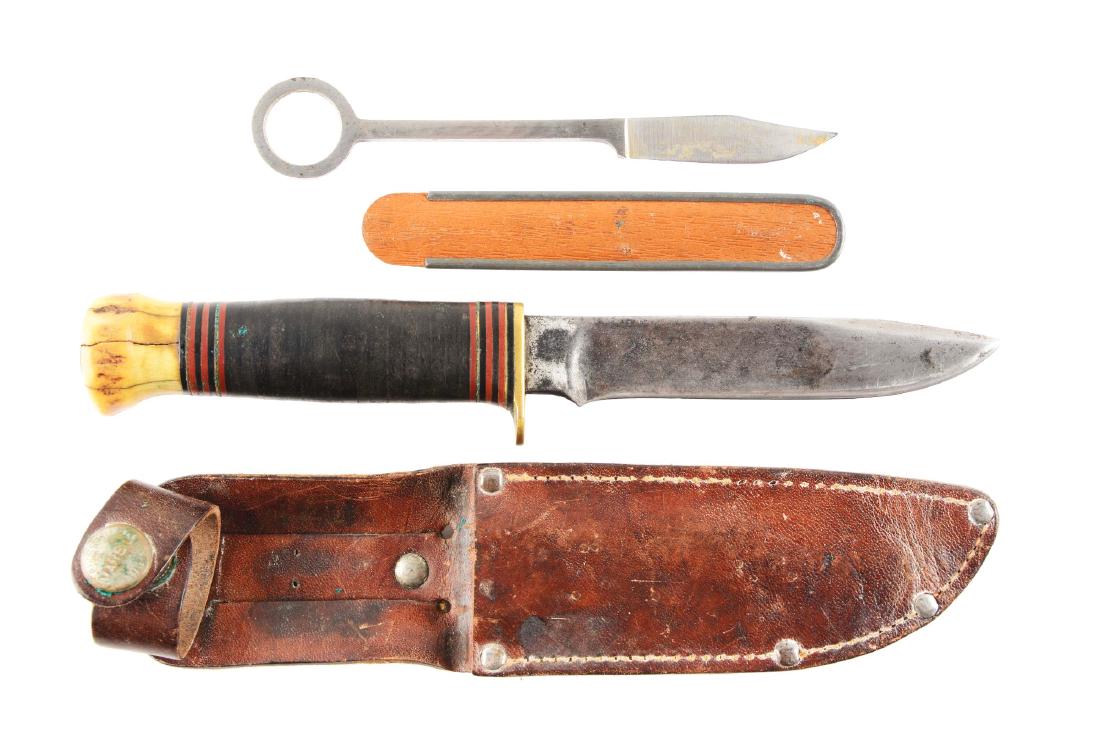 Lot of 2: Marbles Gladstone Fixed Blade Knives.: (A) Marbles Trout knife with 2" blade; overall 5 - 5/8". All one piece metal construction. Non-original leather sheath. Circa pre-1942. (B) Marbles "Ideal" with 4 - 1/2" blade; overall 8 - 1/2". Not a