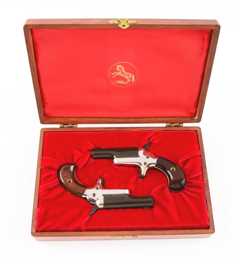 (C) Lot of 2: Cased Colt 4th Model Deringers.: These were offered between 1959 and 1963. They are considered Fourth Model Deringers and have consecutive serial numbers, blued barrels, nickel plated frames, walnut grips, and spur trigger. Both appe