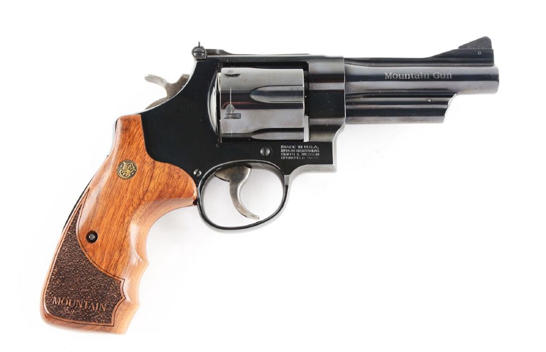 (M) S&W Model 29-8 Mountain Gun Double Action Revolver.: The 29-8 was introduced with a new frame design that utilized an internal locking system. Right side of barrel is stamped "Mountain Gun". Features three screw, round butt, six shot, blue finish, adjus