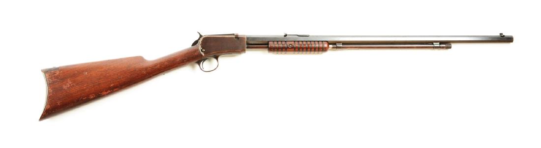 (C) Winchester Model 1890 Slide Action Rifle.: Manufactured 1920. Pretty standard fare that features full octagon barrel, 2/3 magazine, tube fed, takedown, blued finish, grooved walnut forend, and walnut rifle buttstock. Barrel retain about 80-90%