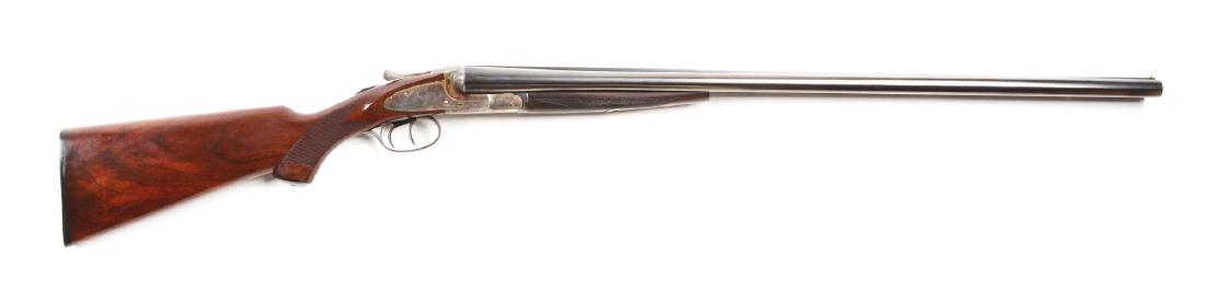 (C) L.C. Smith Ideal Grade Side Lock Shotgun.: Manufactured 1919. Barrels are stamped "LC SMITH 12 GA IDEAL FULTON NEW YORK". The Ideal Grade was introduced in 1913 and continued production until 1950. Frame and plates are engraved with a simple o