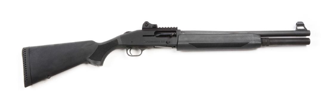 (M) Mossberg Model 930 Tactical Autoloading Shotgun.: Features parkerized finish, extended full tube magazine, tactical adjustable fiber-optic sights, rear peep sight is removable, mounted on rail. Thum-safety. Black polymer stocks with checkered panels 