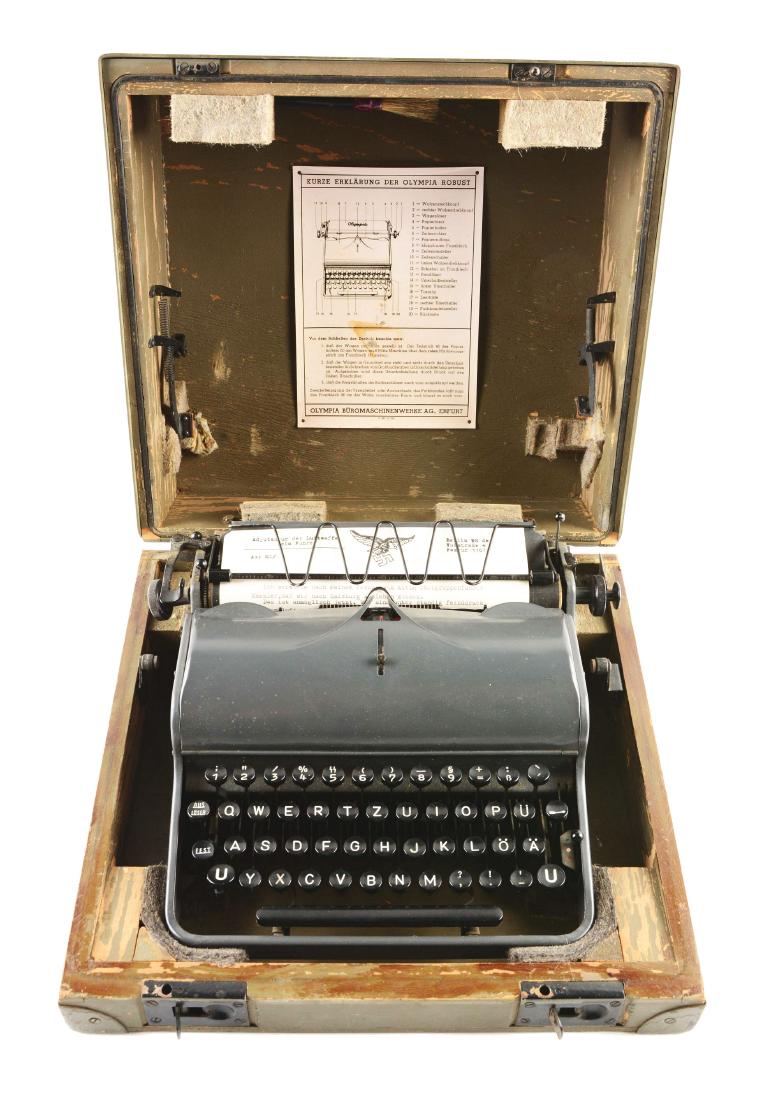 German World War II Military Olympia Typewriter.: German World War II military issue Olympia typewriter. This dark grey steel Olympia typewriter was made in Erfurt, Germany by the “Olympia Buromaschinenwerke AG”. The "5" key has the SS runes abov