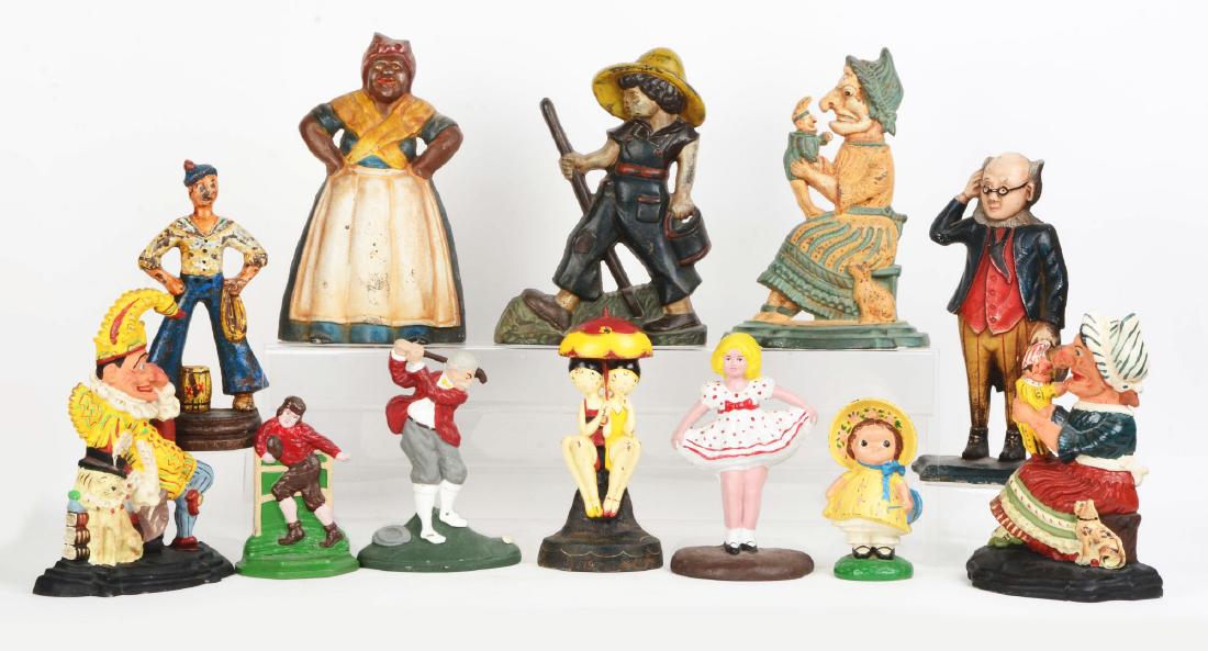 Lot of 12: Cast Iron Doorstops.: All are contemporary. Including Punch & Judy, a Football Player, Bathing Beauties and others. Condition: (Good - Excellent). Dimensions: Largest: 13 - 3/4" x 7 - 3/4".