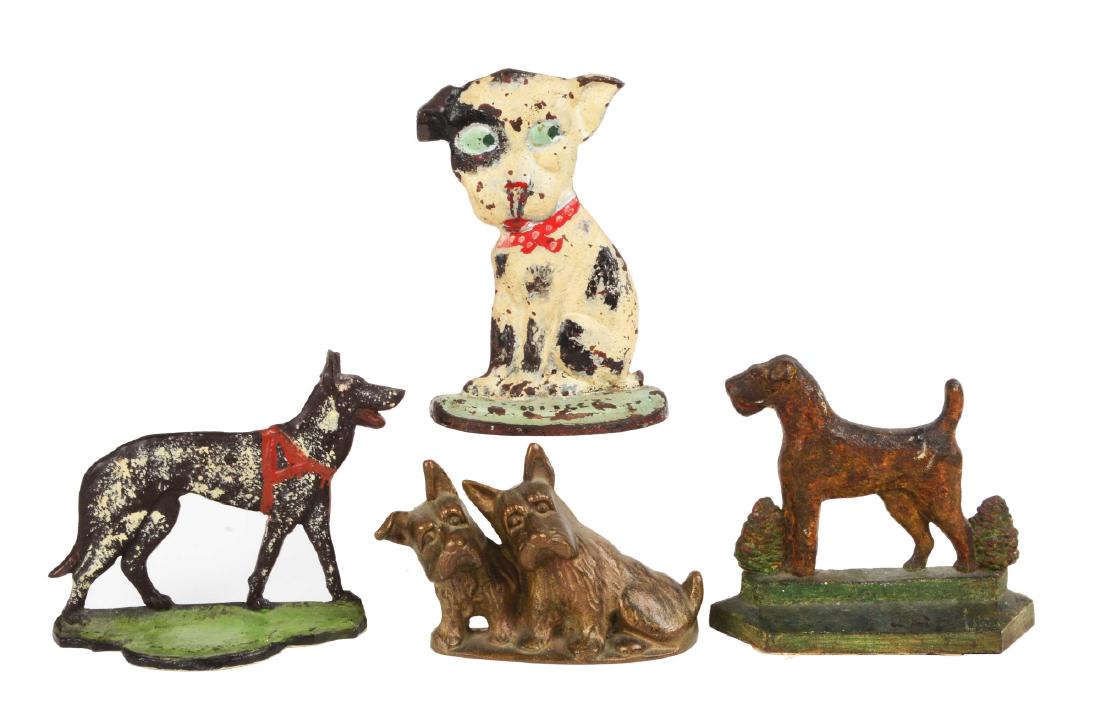 Lot of 4: Cast Iron Dog Doorstops.: Including RARE Greenblatt Pup, twin Scotties, My Pal, and German Shepherd. One is brass. Two have been repainted. Condition: (Good - Very Good). Dimensions: Largest: 8 - 1/2" x 6".