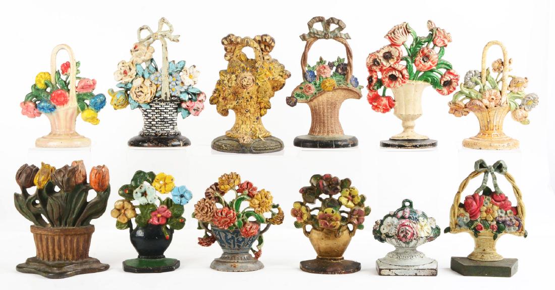Lot of 12: Cast Iron Flower Doorstops. (1 of 1)