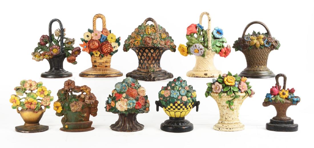 Lot of 11: Cast Iron Flower Doorstops. (1 of 1)