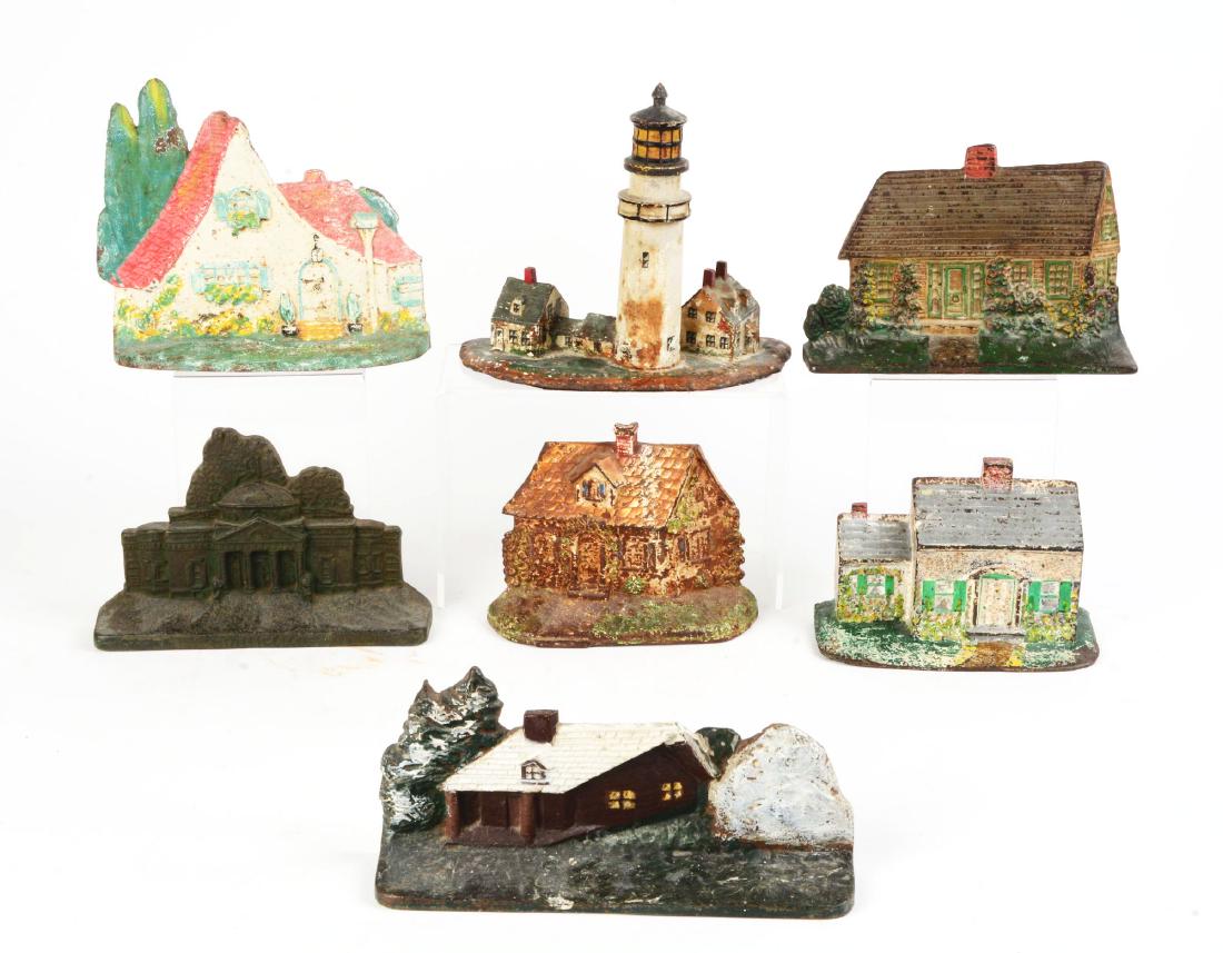 Lot of 7: Cast Iron Cottage Doorstops. (1 of 1)