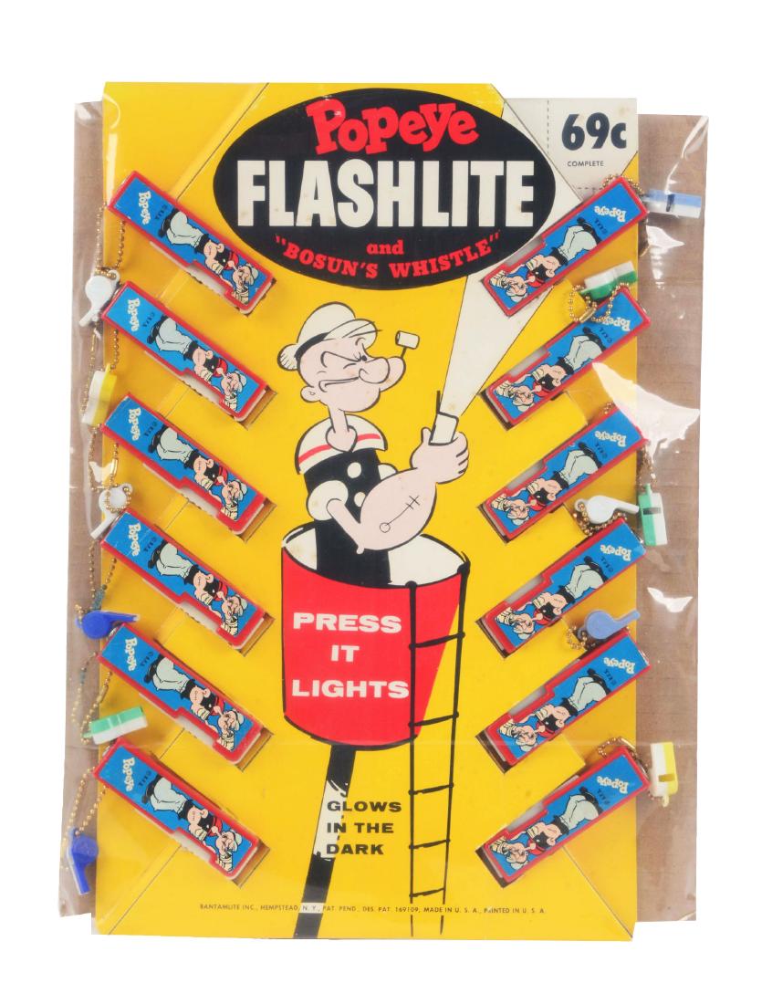 Interesting Bantamlite Popeye Flashlite Store Display.: Display is marked "69¢" on upper right corner. It is full of 12 vintage Popeye flashlights with whistles. Has a nice depiction of Popeye on top of ship using a flashlight. Circa 1950's. Condition: (E