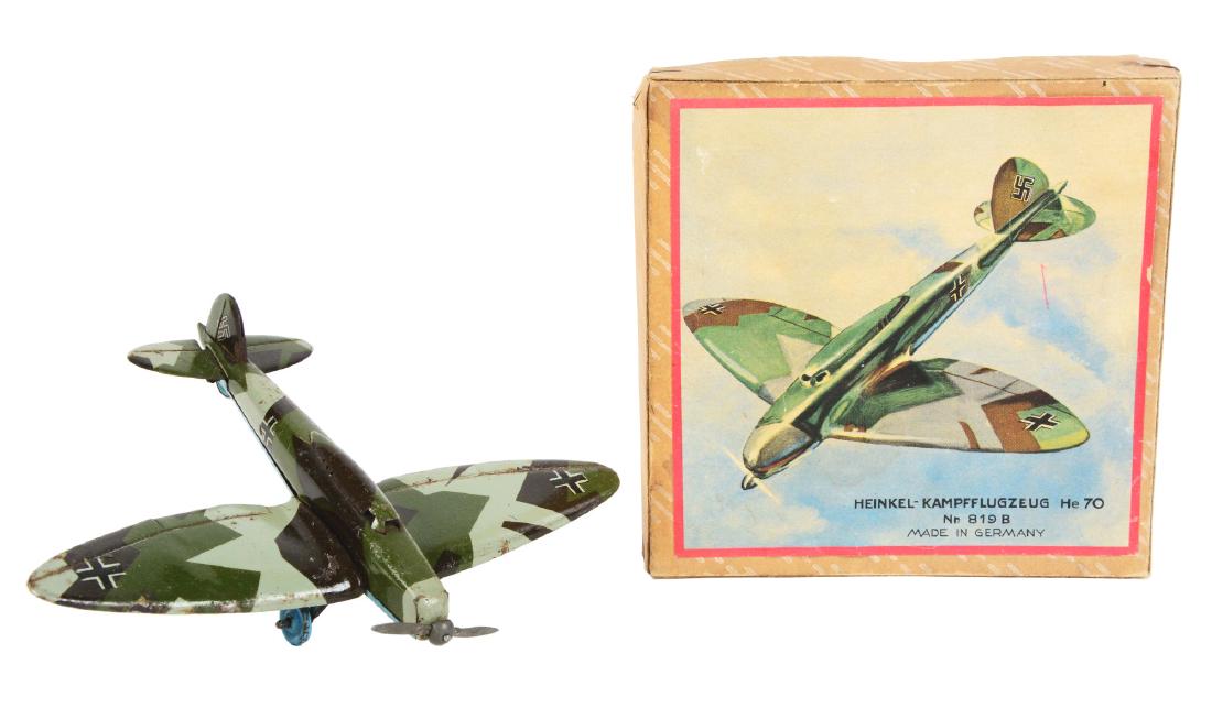 German Lehmann Heinkel Tin Ltiho Airplane in Original: Circa 1930's. Box has nice color label. Airplane shows swastika mark on both sides of rear tail fin, also has Iron Crosses on both wings and original tin propeller. Marked "Made in Germany" on the bot