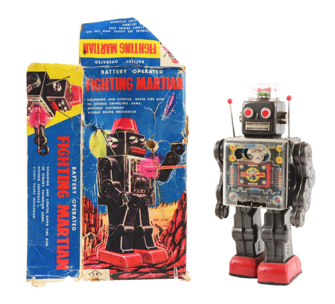 Japanese Battery Operated Fighting Martian Robot.: Includes partial original box, some tearing and poke holes, need to be put back together. Toy itself is tin litho and has a plastic chest piece and machine gun. Dome on top is good, with only some scr