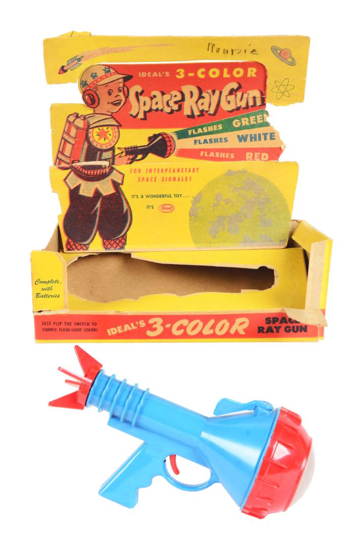 Ideal Space Ray Gun In Original Box.: Original box is very colorful and shows a child in a space outfit with the space gun. Box lid is complete but detached. Includes original Morse Code sheet. Gun itself is plastic, marked "Ideal" on bot
