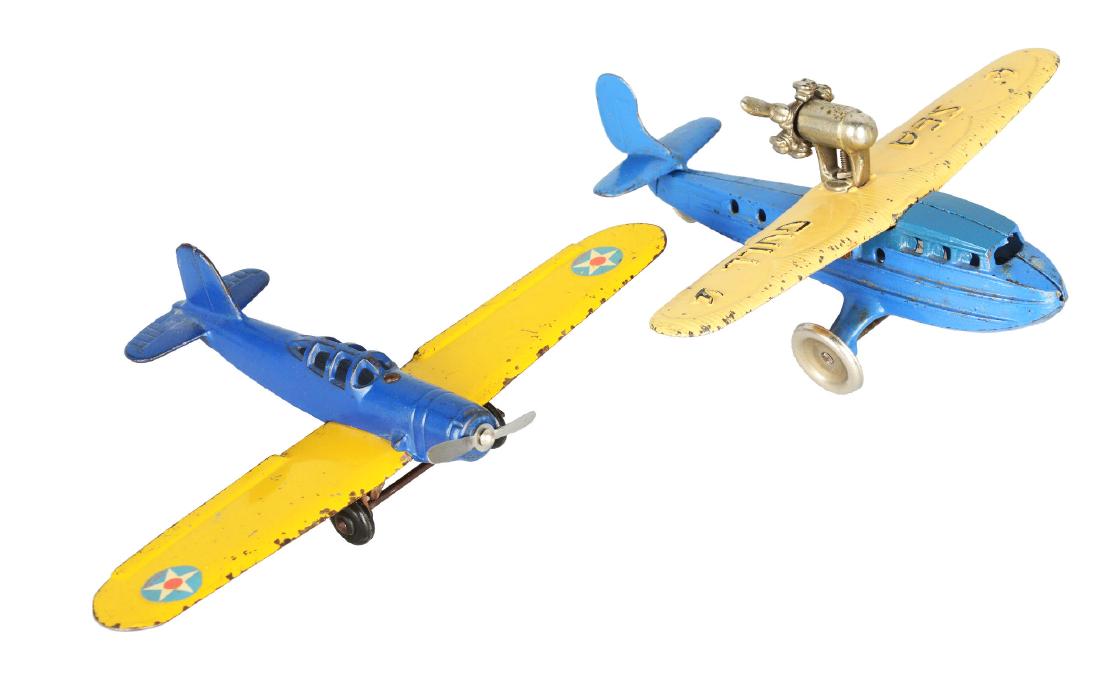 Lot Of 2: Airplane Toys.: This lot of two is comprised of: 1- blue and yellow Kilgore "Sea Gull", 8-1/4"W x 8"D x 3-1/2"T; 1- blue and yellow Arcade Trainer, 10"W x 6-1/2"D x 2"T. Condition: (Good - Very Good). Dimensions: Lar