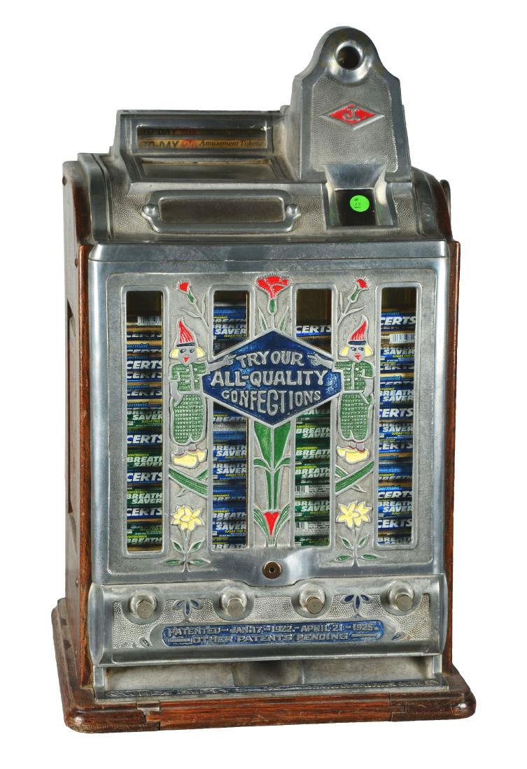 **5¢ O.D. Jennings Today Vendor Slot Machine.: Three-reel vendor front slot machine with charming "Dutch Boy" design, but the cast aluminum front shows minor discoloration. The rotary strip and "To-day" advertisement are original to this machine w