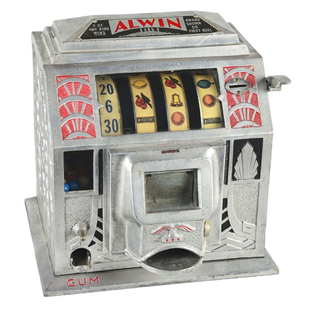 **5¢ Buckley Mfg. Co. Alwin Trade Stimulator.: This countertop trade stimulator has an aluminum body with an all-over Art Deco design, detailed in red and black. It features four reels, with the strips being original to the machine and a gumball d