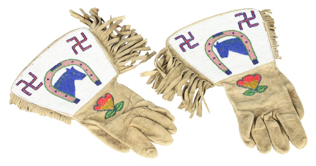 Beaded Pictorial Gauntlets.: A great pair of beaded Wild West Show gauntlets. The gauntlets are constructed of soft leather with fringed sides and large beaded cuffs. The cuffs are densely beaded with a white field, upturned hors