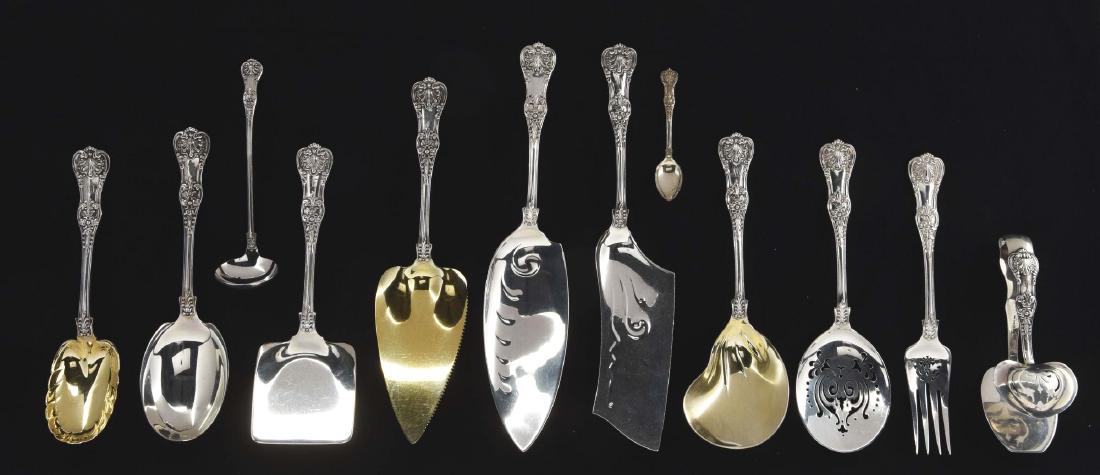 A Group Of Tiffany Sterling Serving Pieces.: English King pattern, including a cake knife with a triangular gilt blade with saw teeth on one side; a berry spoon with a gilt bowl with crimped edges; a serving fork with a pierced section below the