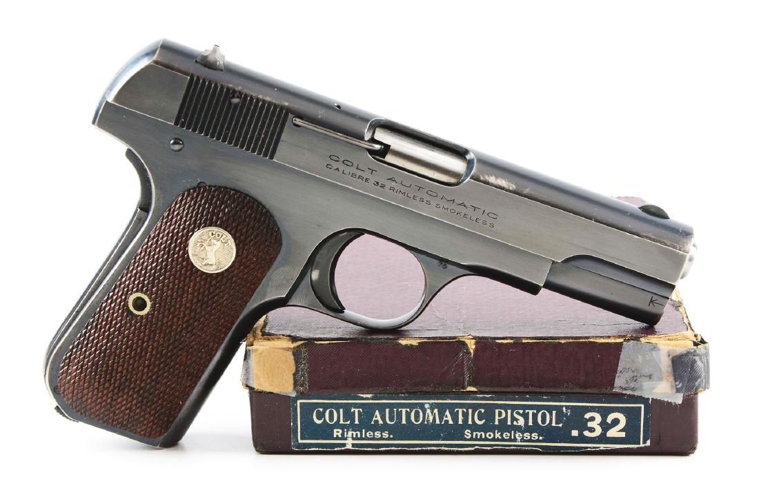 (C) Boxed Colt Model 1903 Semi-Automatic Pistol (1936).: This pistol has seen very little use and is in near new condition inside. Unfortunately there are a couple of light spots on top of slide where the blue is lighter, almost like a storage rub. Features