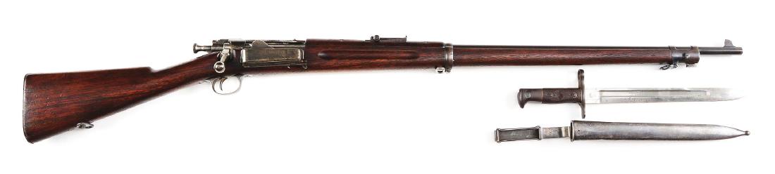 (A) Springfield Model 1896 Krag Rifle With Bayonet.: Gun retains a pleasing even age patina overall with some traces of original finish here and there. Markings are clear. Clear 1897 dated cartouche. Fine mechanical function. Bore is good with strong ri