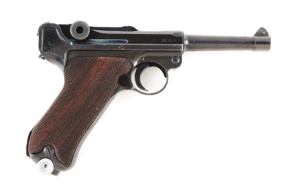 (C) Nazi Marked German Mauser P.08 Luger 1940 Dated: Manufactured for the German military by Mauser. This is a 1940 chamber date code 42. Features include; round barrel with dovetailed inverted V front sight, V notch rear sight on rear link, thumb safet