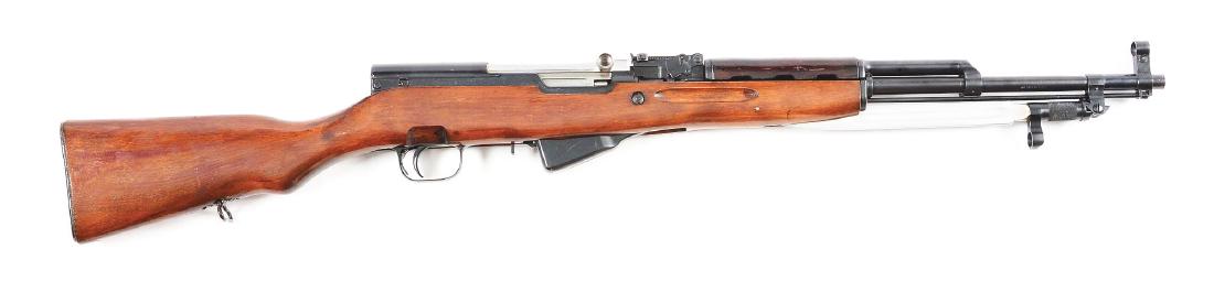 (C) Russian SKS Semi-Automatic Rifle.: Manufactured and dated 1951. This is a fairly early example, introduced in 1946 with ten shot fixed box magazine, blued finish and two-piece wood stock. Serial numbers on receiver, bolt, carrier, top