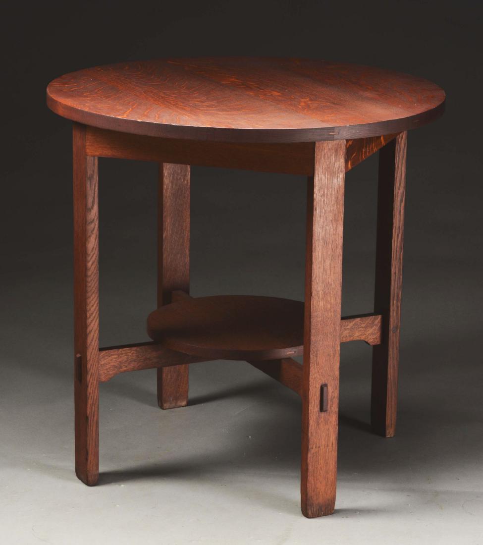 Stickley Brothers 30" Round Lamp Table, No. 2508.: Stickley Brothers, Grand Rapids, Mich., 30" Round Arts & Crafts Lamp Table in quartersawn oak, Model No. 2508. Excellent pinned mortise and tenon construction with lower shelf over crossed arched stre