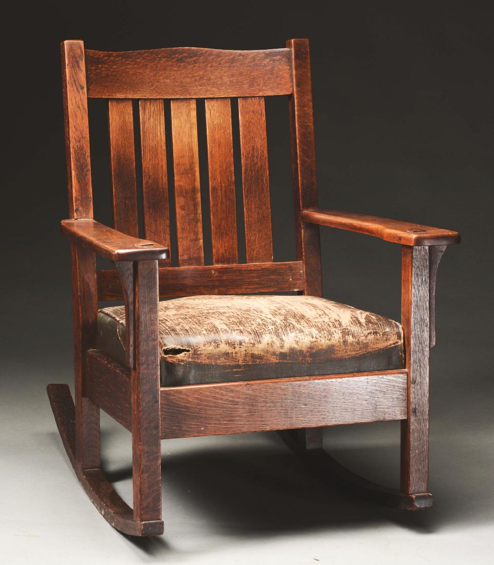 JM Young Humpback Armchair Rocker, No. 368.: JM Young, Camden, New York. Arts & Crafts Hump-back Armchair Rocker, Model No. 368, in quartersawn oak with original finish and original drop-in spring cushion seat with original oil cloth/leatherette