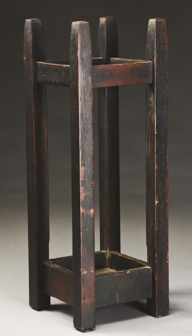 Gustav Stickley Pencil-Post Umbrella Stand, No.54.: Gustav Stickley Pencil-Post Large Umbrella Stand, Model No. 54, in quartersawn oak. Signed on side with small red joiners compass decal with "Als Ik Kan" motto above "Stickley" in script. Circa 1904. 