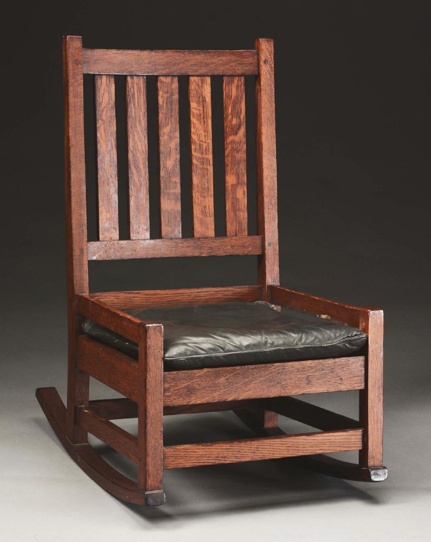 Gustav Stickley Hip-Rail Rocker, No. 327.: Gustav Stickley Arts & Crafts Sewing Rocker in quartersawn oak, Model No. 327. Hip-rail design with drop-in leather cushion supported by a rope foundation. Pinned, mortise and tenon construction. Refi
