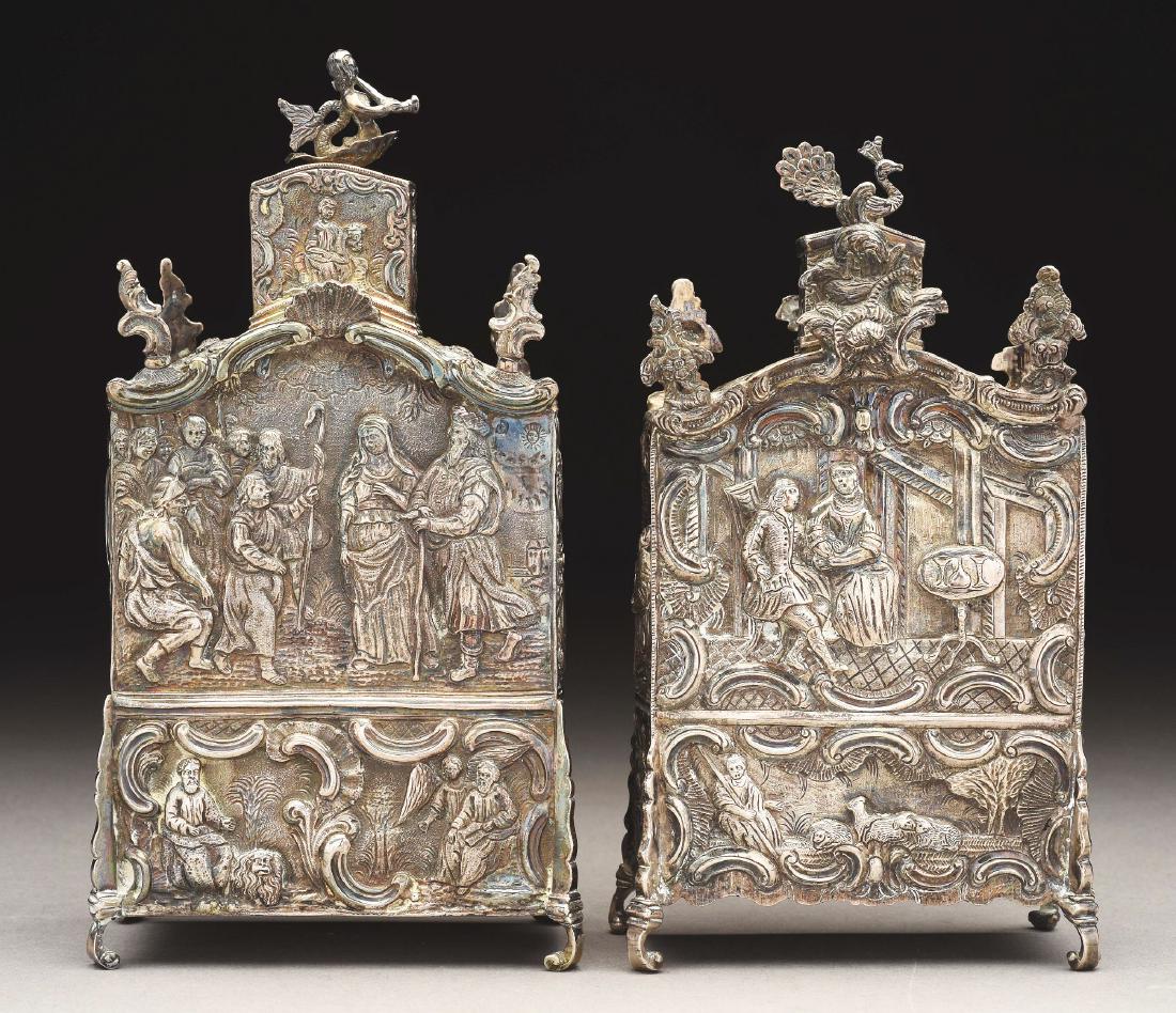 Lot Of 2: Pair of Continental Silver Rococo Allegorical: 18th to 19th century. Each with small unidentified hallmark. The first engraved with religious scenes of various time periods, 7" tall. The second engraved with scenes of Renaissance daily life includ