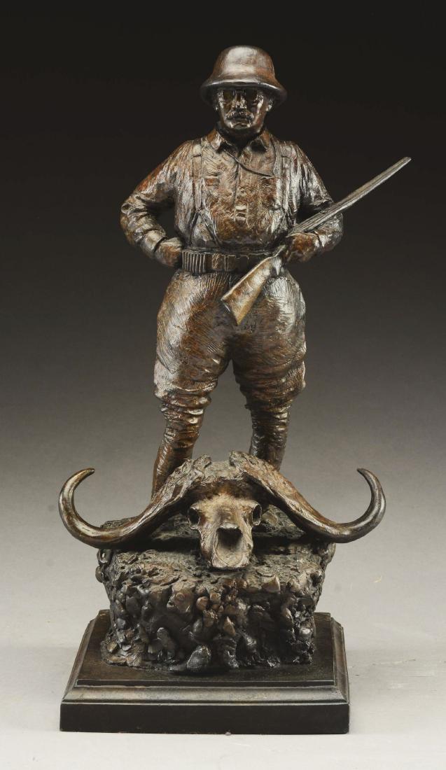 Michael B. Coleman Bronze Statue.: The bronze depicts Teddy Roosevelt in a pith helmet, shotgun over his left arm, standing in front of the skull of a long horned sheep, on a rock work base on a molded plinth. No foundry mark. Very goo