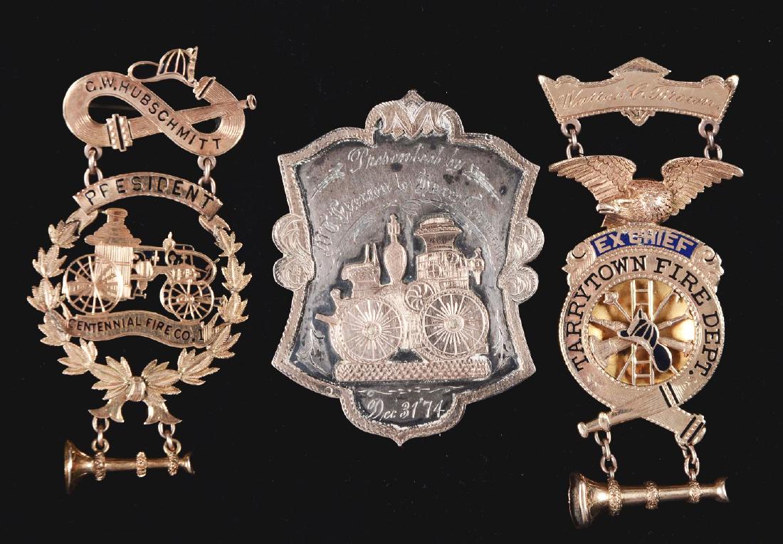 Lot Of 3: Gold Presentation Badges.: The first is a 14K gold suspension badge. Presented to Ex Chief Warren C. Brown of Tarrytown Fire Department. The second is a solid gold suspension badge. Presented to C.W. Hubschmitt the President of