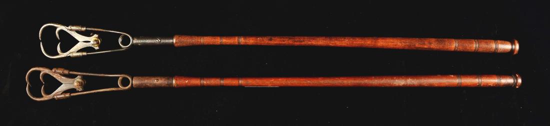 Lot Of 2: Marbles Automatic Fish Gaffs.: Early 20th century, American. One is marked "W.L. Marbles Mfg Pat Allowed", the other is not, but is of a similar design. Both show appropriate wear and corrosion to metal parts, in operable condition