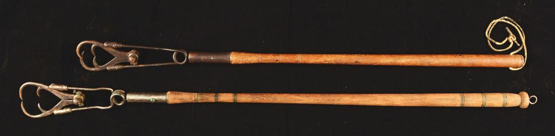Lot Of 2: Unmakred Marbles Style Automatic Fish Gaffs.: Early 20th century, American. Both are unmarked but of similar designs. One with shortened handle has drilled holes to accommodate a rawhide loop handle. Both show appropriate wear and corrosion to me
