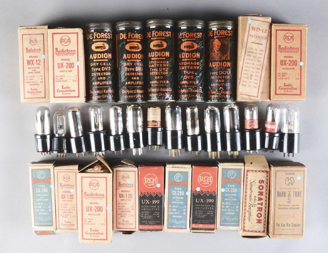 Large Lot Of 34: Deforest, RCA WD-11 and WD-12 and: One group includes 34 vacuum tubes including some De Forest in metal cans; 14 are WD-11 and WD-12 tubes, all have good filaments. The other group contains new in the box vacuum tubes including UX-200,