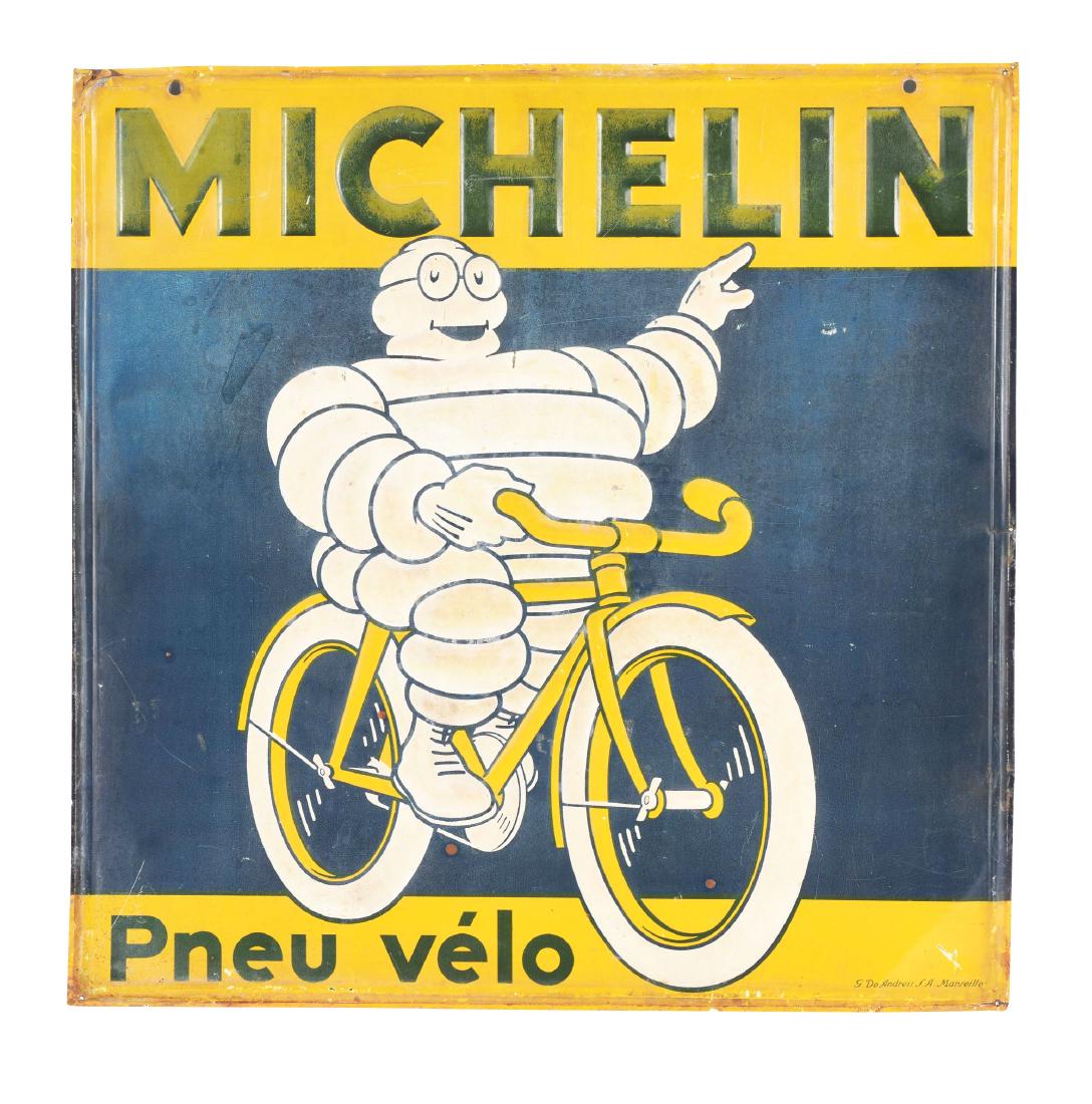 Michelin Tires Embossed Tin Sign with Bibendum On: SST. A great piece of advertising from Michelin Tires. Sign shows an excellent graphic, with a fairly clean field free of any major wear. Sign shows some minimal fading in the colors, and some light w