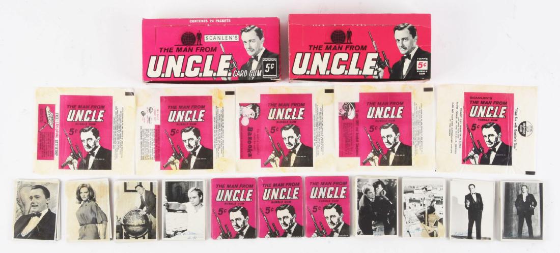 Incredible Lot Of Topps & Scanlen "Man From U.N.C.L.E.": This is an incredible lot of scarce "Man From U.N.C.L.E." items, including an empty wax box showing Robert Vaughn on front holding a pistol. The 5Â¢ box has been meticulously glued back together. "1