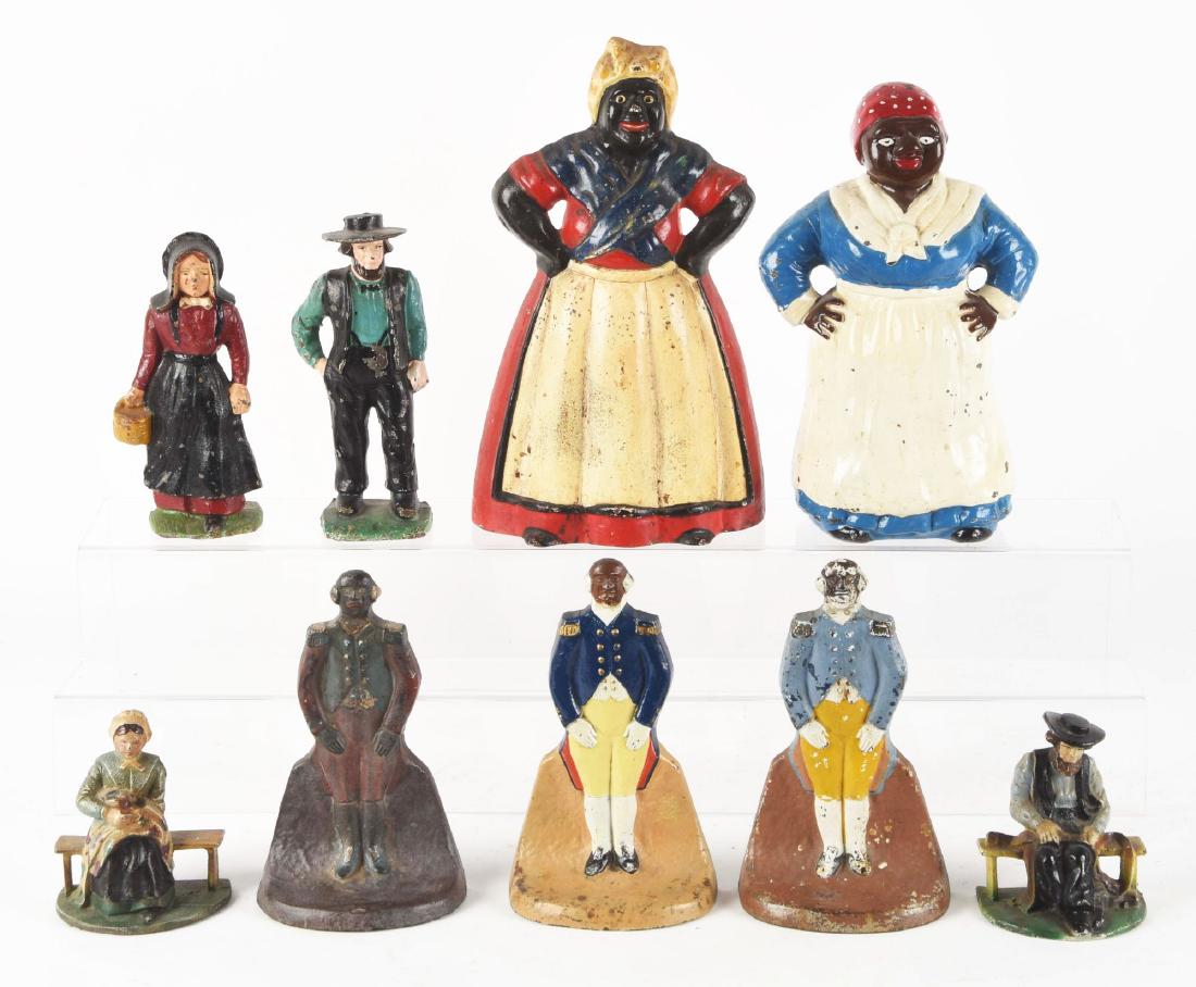 Lot Of 8: Assorted Figural Cast Iron Doorstops &: Includes Amish Man and Women, Oversize Mammy, Major Domo, etc. One is lead and two are repaints. Condition: (Good - Very Good). Dimensions: Largest: 13 -1/2" x 8".