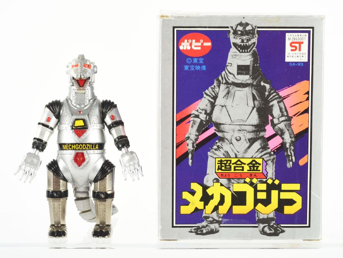 Mech-Godzilla GA-93 Boxed Popy Chocokun Figure.: Includes the original box. This figure is 4-1/2" tall, made of painted die-cast metal and plastic and depicts Godzilla's mechanical adversary, Mech-Godzilla. It has one set of hands which can be fired