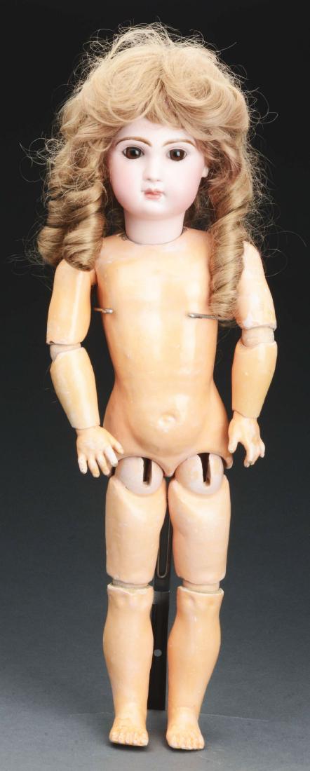 Pretty Closed Mouth Tete Jumeau 9.: Doll has head stamped on the back in red "Depose Tete Jumeau 9". Head has a closed mouth, amber brown paperweight glass eyes, well painted lashes and brows and pierced earlobes, mounted to a fully art