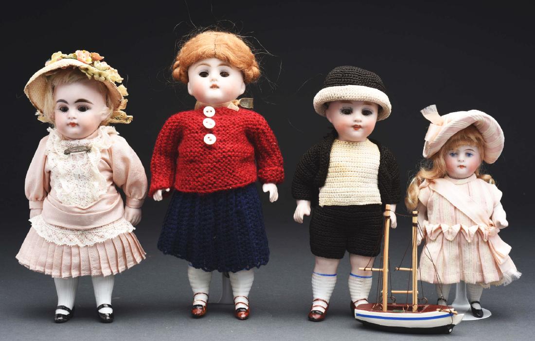 Lot of 4: Kestner All Bisque Dolls.: The smallest is marked "600 4" and has painted features and original blonde mohair wig with jointed shoulders and stiff hips with waffle-weave hose and black strap heeled shoes, and very nicely redres