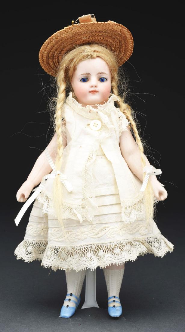 French All Bisque Mignonette Doll with Blue Shoes. (1 of 3)