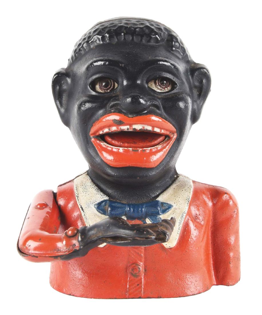 English Jolly N. with Butterfly Tie Mechanical Bank.: Made of cast iron. Condition: (Excellent-Near Mint). Dimensions: 6 -1/2" x 5".