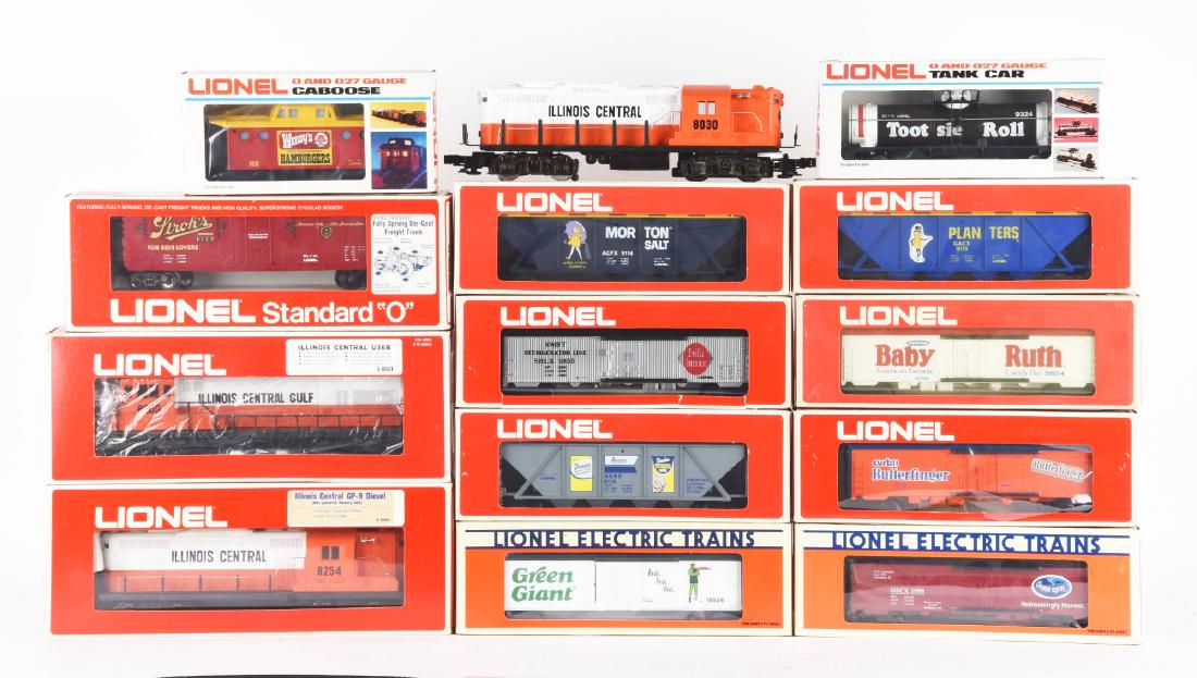 Lot Of 14: Lionel Illinois Central Diesels and: Lot consists of: No. 8030 Illinois Central GP9, No. 8669 Illinois Central U36B, No. 8254 Illinois Central GP9, No. 9115 Planter's Billboard Hopper, No. 9854 Baby Ruth Reefer, No. 9858 Butterfinger Ree