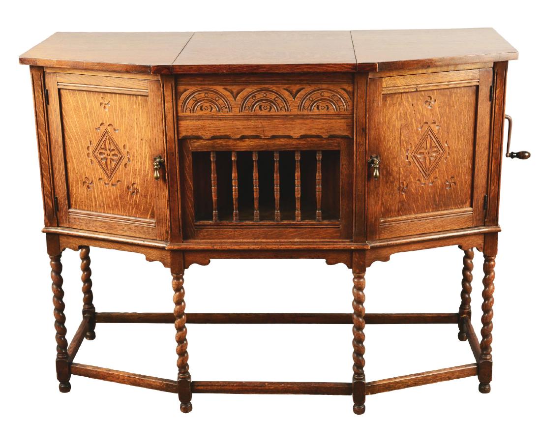 Pathe Model XXI Pathephone Phonograph.: The Pathe Freres Phonograph Co. of New York made these quality machines in the early 1900s. The stunning oak cabinet has spoon carvings, rope twist legs, and beautiful grain patterns. The center top o