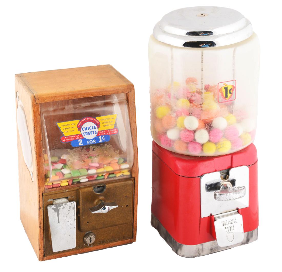 Lot Of 2: 1¢ Gumball Vending Machines.: This lot of two includes 1- 1¢ Baby Grand Deluxe gumball machine, manufactured by Victor Vending Corp. in 1951. It has an oak cabinet with plastic front and side panels, complete with a decal reading