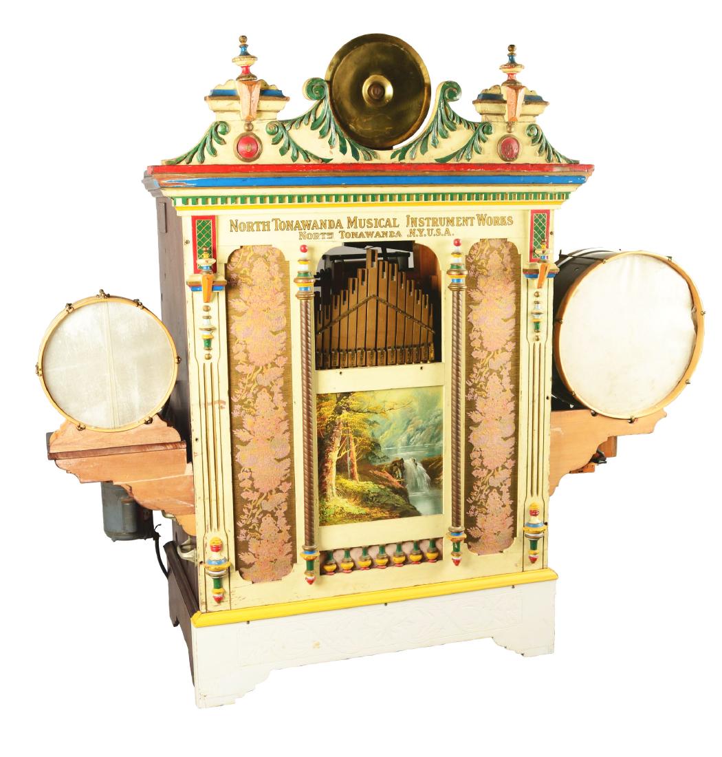 North Towanda Style 56 Band Organ.: The North Towanda Musical Instrument Works of New York made these band organs between 1906 and 1916. It has 14 violin pipes in front surrounded by a painted facade, and 72 more pipes inside. It plays